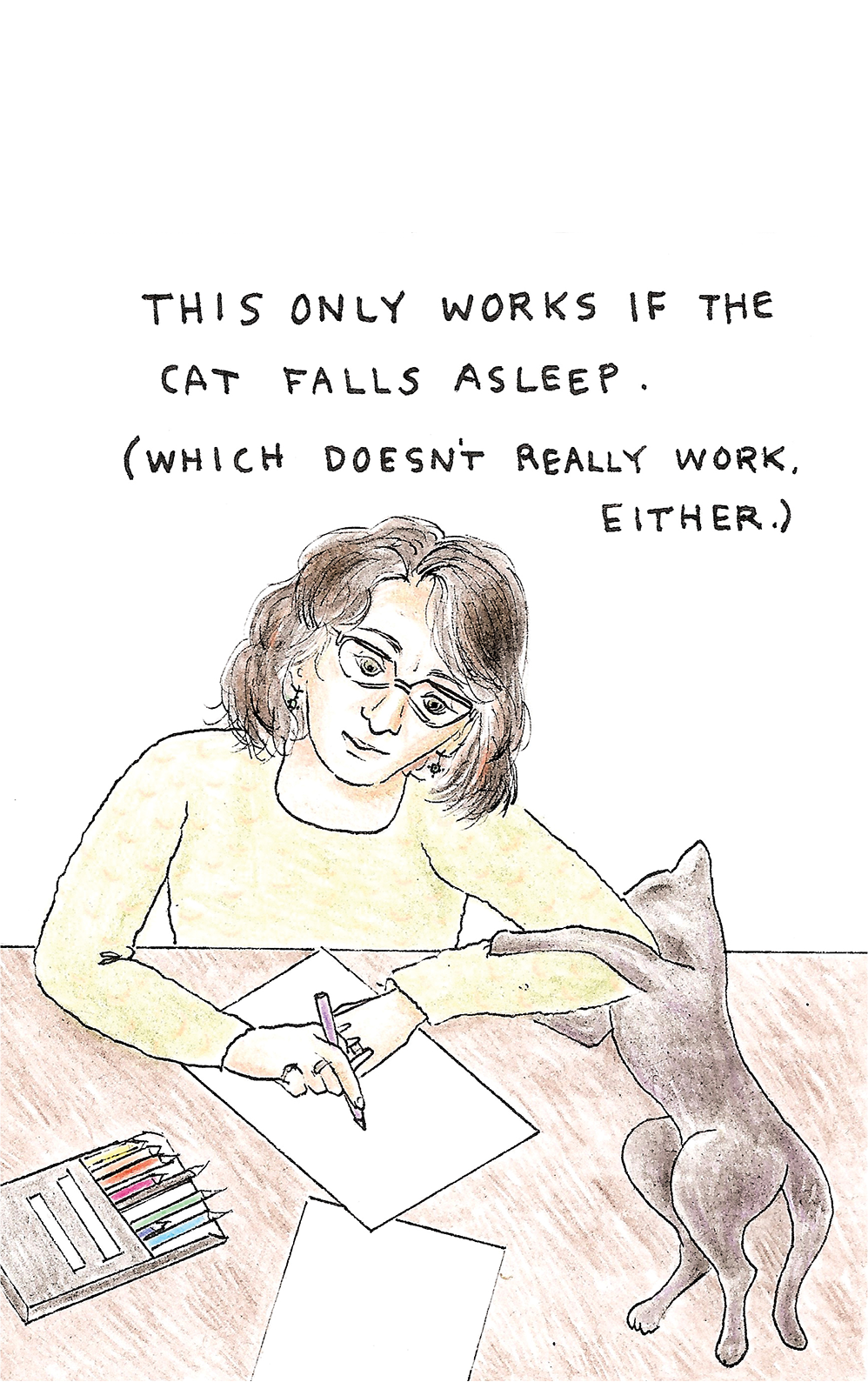 Linda Hornberg at work with kitty.